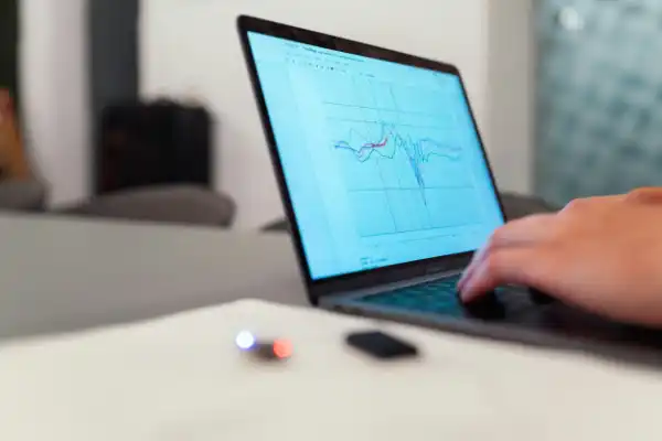 hands typing on laptop keyboard